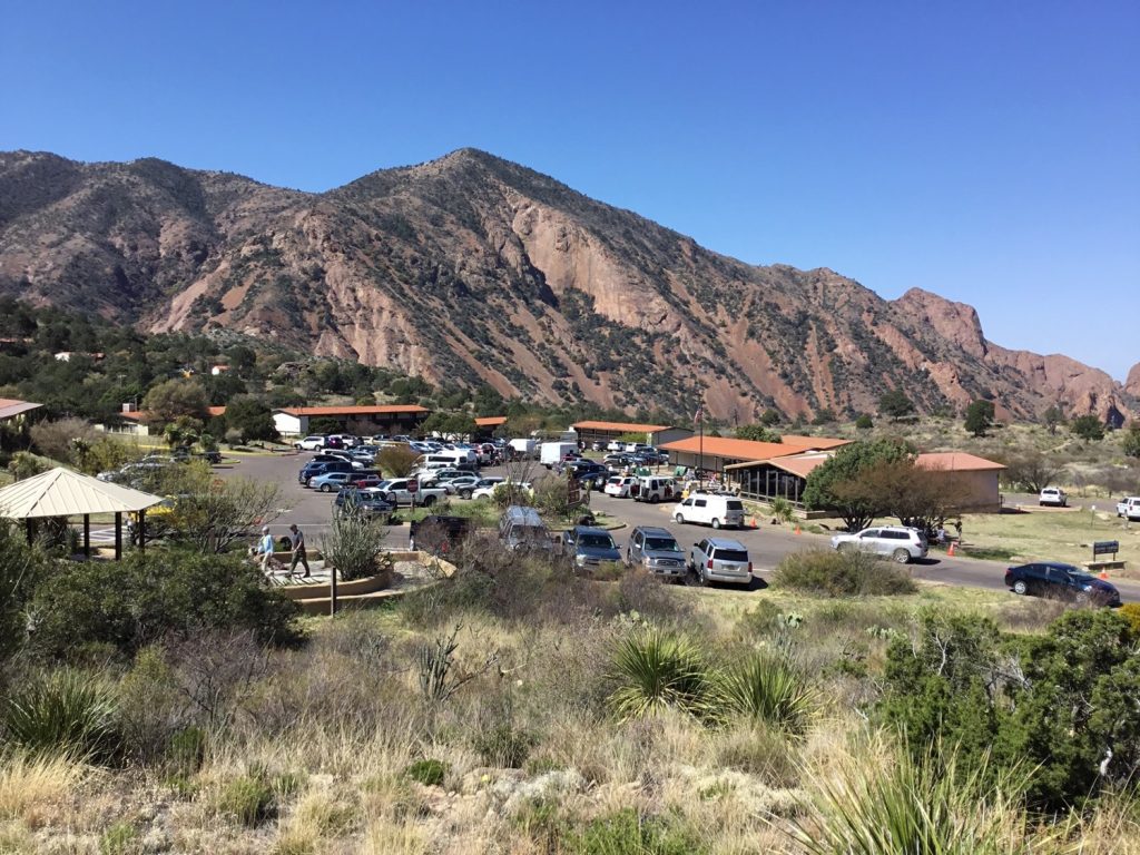 The Chisos Basin is a focal point for park visitors. The lodge, visitor center, store, and trailhead is located around the parking area.