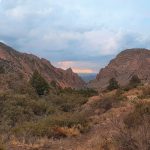A stunning view of The Window in the Chisos Mountains on a cloudy day.